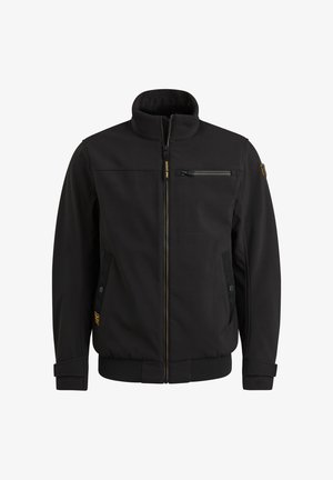 Schwarze Jacke mit Reißverschluss und Stehkragen, Brustreißverschlusstasche, Seitentaschen mit Druckknöpfen und Logoaufnäher am linken Ärmel sowie in Taillennähe.