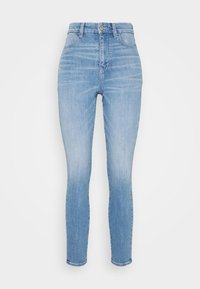 Ljusblå skinny jeans med hög midja, tillverkade av denimtyg. Har fem fickor, framknapp och en slät finish.