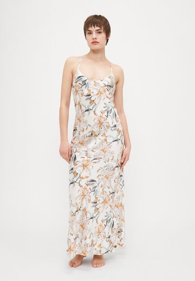 Floral maxi dress with spaghetti straps. Features white fabric adorned with orange and gray floral patterns. Silky texture, fitted silhouette.