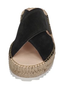 Black suede espadrille sandal with crisscross straps, jute midsole, and white rubber outsole. Features stitched detailing along the edges.