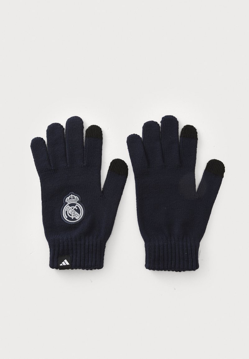 Marineblaue Strickhandschuhe mit schwarzen Fingerspitzen, versehen mit einem runden grauen Logo und einem schwarzen Akzent am Handgelenk. Hergestellt aus weichem, elastischem Stoff.