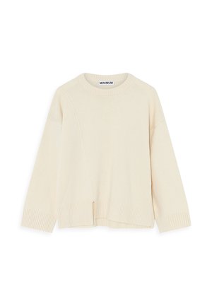 Krēmkrāsas džemperis ar apaļu apkakli, ribotām piedurknēm un apakšmalu, kā arī nelielu pārmērīgu izmēru. Iezīmējas ar diagonālo šuvju detaļu priekšpusē.