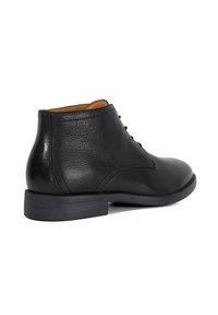 Black leather ankle boot with smooth texture, rounded toe, lace-up front, and a slight heel. Interior features tan accents.