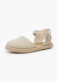 Beige espadrillid kanvas ülemise, ümmarguse toe ja pahkluustrapiga. Omab punutud jute tallat ja tekstureeritud kangast.