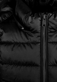 Black puffer jacket with a smooth texture, featuring horizontal quilted panels and a central zipper. The zipper is black metal with a pull tab.