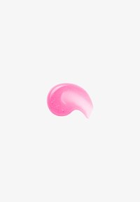 Blank, kurvet stryk av rosa gel eller krem med små glitrende partikler på lys grå bakgrunn.