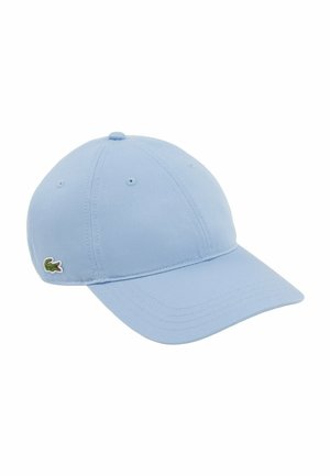 Light blue baseball cap with stitched panels, ventilation holes, curved brim, and small green crocodile logo on the side.
