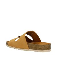 Beige Wildledersandale mit Ausschnitt-Design, Kork-Mittelsohle und weißer Gummisohle. Mit flachem Absatz und offenem Fersenbereich für einfaches An- und Ausziehen.