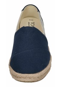 Navy canvas slip-on shoe with a woven jute sole. Features a seamless upper and a rounded toe design, providing a casual, lightweight appearance.