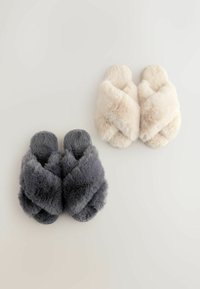 Faux fur slide slippers in gray and cream, featuring a crossed design, plush texture, and rounded toe. Soft, cozy look for indoor wear.