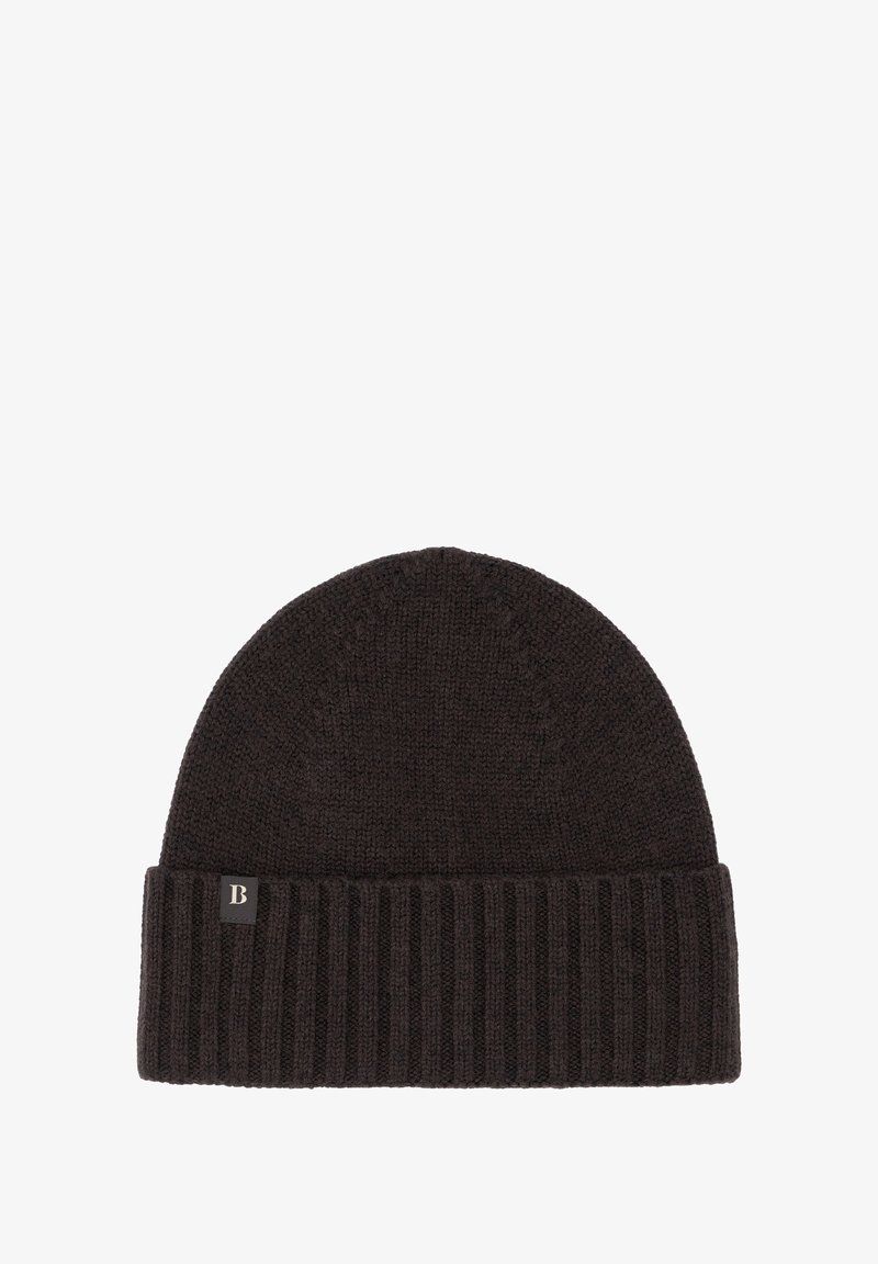 Tumepruun kudumüts ribaga ääress ja peene tekstuuriga. Ees on väike, ristkülikukujuline brändi silt.