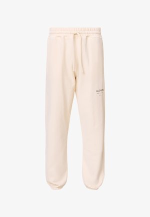 Pantaloni da jogger di colore crema realizzati in tessuto morbido. Presentano una cintura elastica con lacci e caviglie elastiche. Logo stampato di lato.