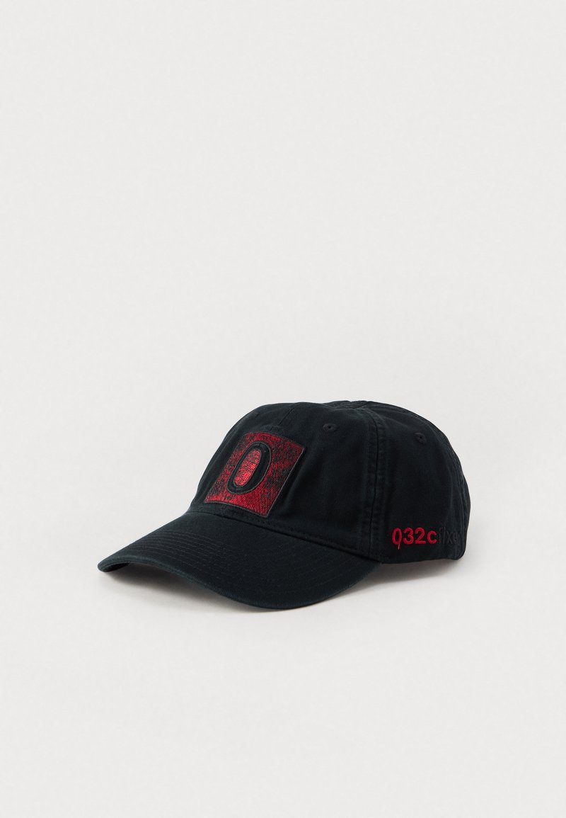 Black baseball cap made of cotton with a red textured logo patch featuring the letter "O" and the text "Q32C" embroidered in red on the side.