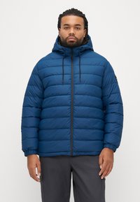 Blue puffer jacket with a hood, featuring horizontal stitching, black zipper, and adjustable drawstrings. Textured and insulated material.
