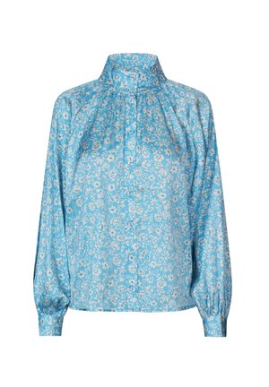 Blusa floreale azzurro chiaro con colletto alto, chiusura con bottoni sul davanti e lunghe maniche a sbuffo. Presenta un delicato motivo floreale bianco su tutto il tessuto.