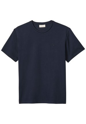 Tumesinine puuvillane t-särk ümara kaelusega, lühikeste varrukatega ning väike tikitud logo vasakul rinnal. Sile tekstuur, lihtne disain.