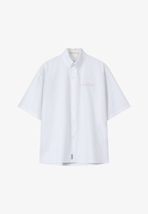 Fehér, rövid ujjú, galléros ing gombokkal, a bal mellrészen finoman hímzett "another." felirattal.