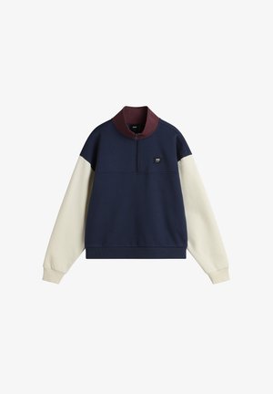 Mörkblå och krämfärgad färgblockerad sweatshirt med krämfärgad krage, halv dragkedja och logotypdetalj på bröstet. Mjuk, strukturerad tyg.