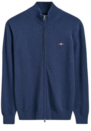 Maglione zip-up blu navy con colletto alto a coste, realizzato in morbido tessuto a maglia, con un piccolo logo sul lato sinistro del petto e polsini a coste.