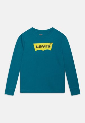 Teal langærmet skjorte med et gult Levi's-logo placeret midt på brystet, rund hals og enkel syning på ærmer og kant.
