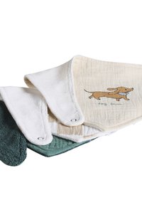 Stack of three soft fabric baby bibs in green, white, and beige; beige bib shows running dog illustration with "dog lover" text.