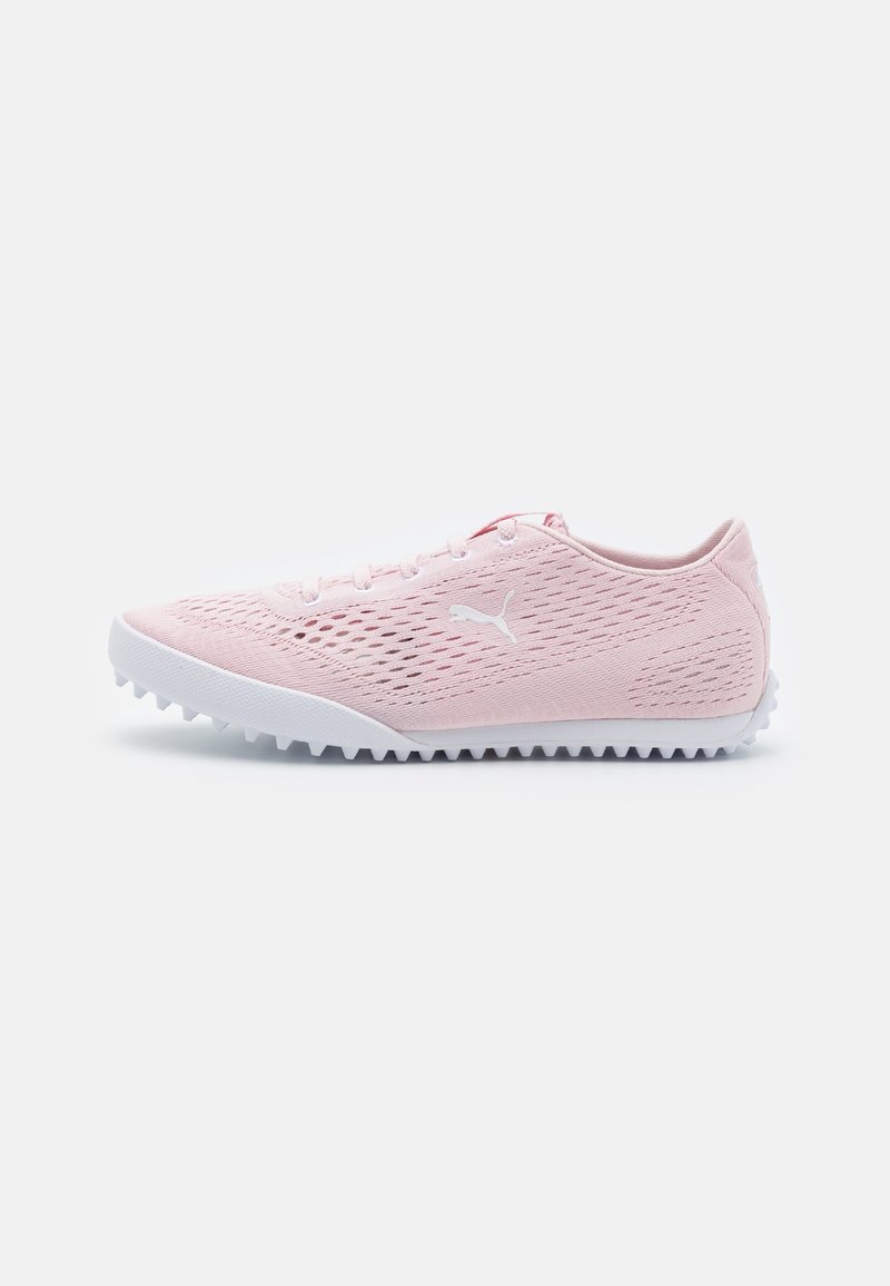 Light pink Puma sneaker with white sole and logo, breathable mesh upper, and textured grip outsole, shown in side view.