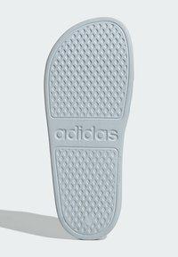 Gray rubber sole with a textured diamond pattern and "adidas" logo molded in. Rounded shape, smooth edges, suitable for footwear.