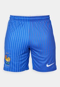 Blå idrottsshorts med vertikala ränder i vitt och rött. Har en broderad tupplogotyp och Nike-swoosh på den nedre fronten.