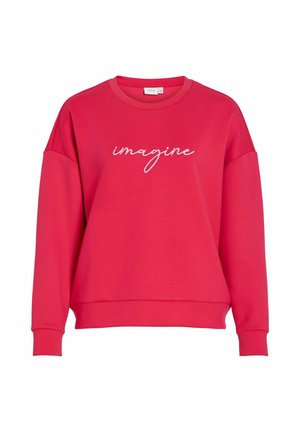 Rdeč pulover s sproščenim krojem, okroglim izrezom in dolgimi rokavi. Na sprednji strani belo našit napis "imagine" v pisavi.