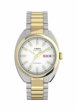Reloj de pulsera automático Timex Marlin con esfera blanca, pulsera metálica en oro y plata, marcadores horarios luminosos y pantalla de día y fecha que muestra domingo 14.
