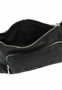 Black leather bag with a textured surface, featuring silver zippers and a visible logo. The interior is lined with black fabric.