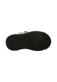 Die Außensohle des Schuhs verfügt über eine strukturierte schwarze Gummifläche mit verschiedenen Mustern für besseren Grip; die seitlichen Bereiche zeigen weiße und blaue Akzente.