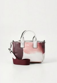 Mini handbag with a gradient design in burgundy and blush, featuring white accents, dual handles, and an adjustable strap. Smooth texture.