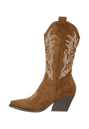 Bruine suède cowboylaars met puntige neus en een hak van 7,5 cm. Heeft witte borduursels in een bloemmotief langs de schacht.