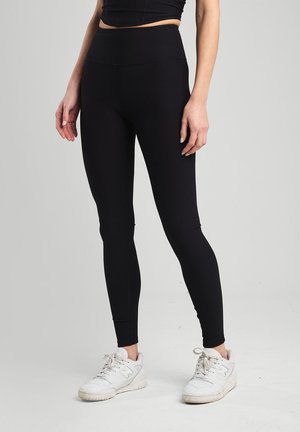 LILA - Leggings - Hosen - black