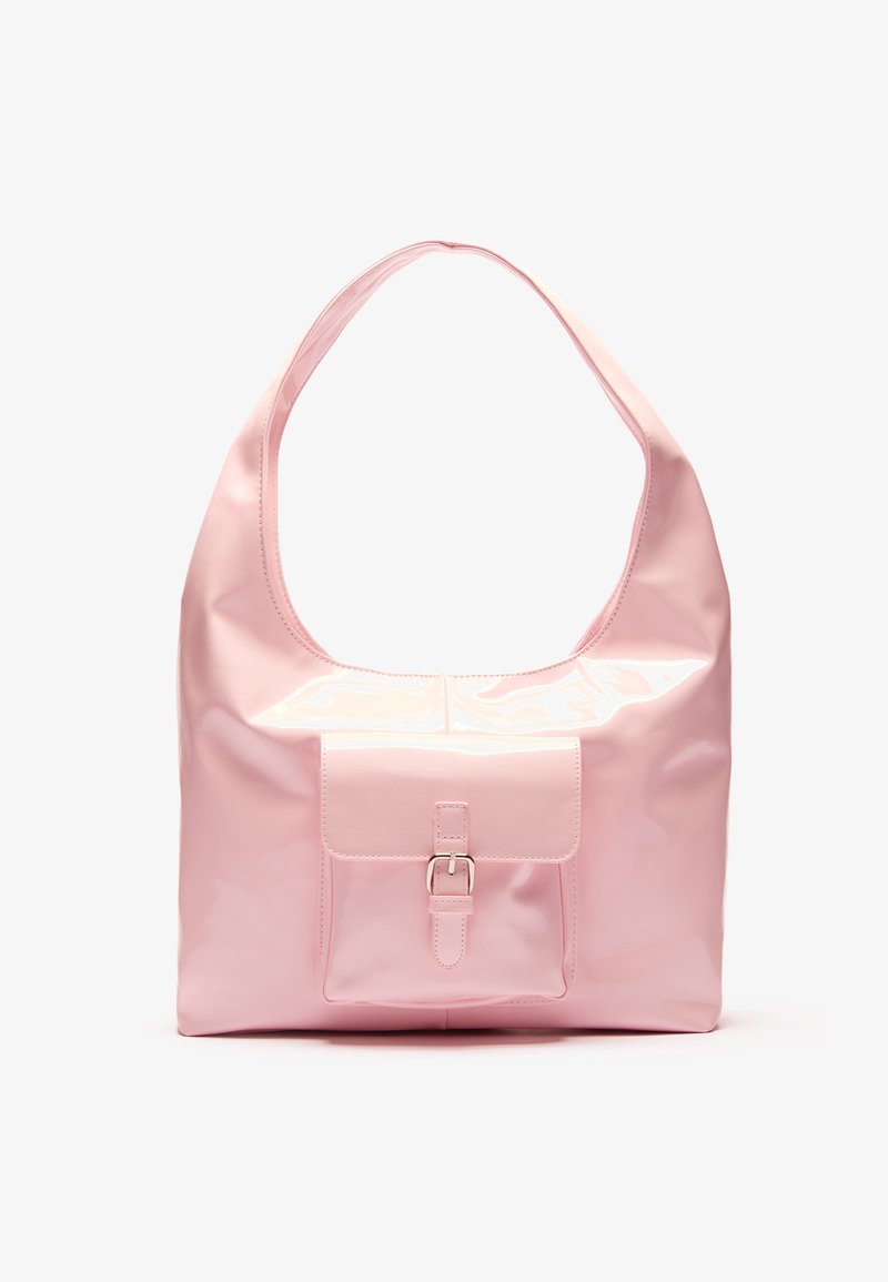 Pink handbag with a glossy finish, large shoulder strap, front pocket with a decorative buckle detail. Smooth texture, minimalist design.