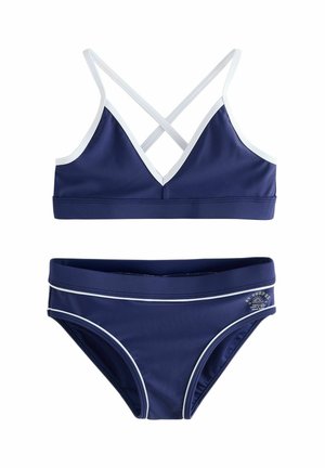 Marineblauer zweiteiliger Badeanzug mit weißer Umrandung, Oberteil mit gekreuzten Trägern und Hose mit kleinem weißem Logo an der Hüfte.