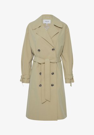 Beige trenchcoat med dobbeltradet front, stor krave og sidebånd detaljer. Har sorte runde knapper og en bælte-livet.