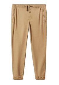 Pantalon beige fuselé avec une taille élastique, un cordon de serrage et des poches latérales. Tissu lisse avec des bas de jambes élastiques.