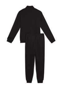 Completo tuta nera composto da giacca con zip a maniche lunghe e colletto, abbinata a pantaloni affusolati con polsini elastici. Tessuto morbido ed elastico.