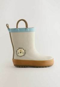 Botte en caoutchouc pour enfants couleur crème avec une bordure bleu clair, ornée d'un design de visage de lion sur le côté, semelle marron et une texture pour une meilleure adhérence.