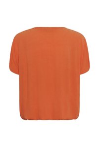 Blouse ample à manches courtes, orange uni, avec un large col rond et un ourlet froncé en bas.