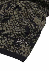 Sciarpa nera lavorata a maglia con spruzzate dorate e un motivo testurizzato. Presenta un piccolo dettaglio del logo con strass sul bordo.