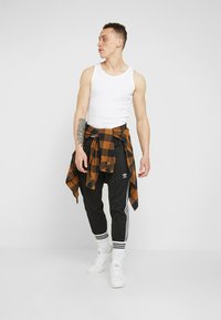 adidas Originals BECKENBAUER - Tracksuit bottoms - black