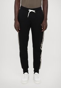 EA7 Emporio Armani PANTALONI - Treniņtērpa apakšdaļas - black
