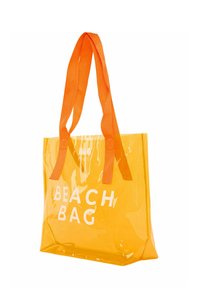 Prozoren oranžni plažni nahrbtnik z dvema pletenima oranžnima ročajema in belim napisom "BEACH BAG", ki ima pravokotno obliko in gladko teksturo.