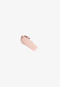 Nuance de maquillage crème mate rose clair avec des bords irréguliers sur fond blanc uni.