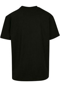 Black short-sleeve T-shirt made of cotton. Features a crew neckline and a relaxed fit. No visible patterns or accents. Rear view shown.
