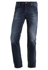 Mörkblå denimjeans med smal passform, lätt blekning, femfickorsdesign och metallknappstängning med dragkedja.