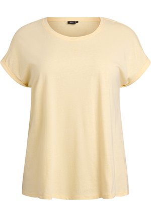 Apaļas apkakles, īsroku krekls no mīksta, gaiši dzeltena materiāla. Raksturīgas savērptas aproces un brīvs piegriezums ar gludu tekstūru.